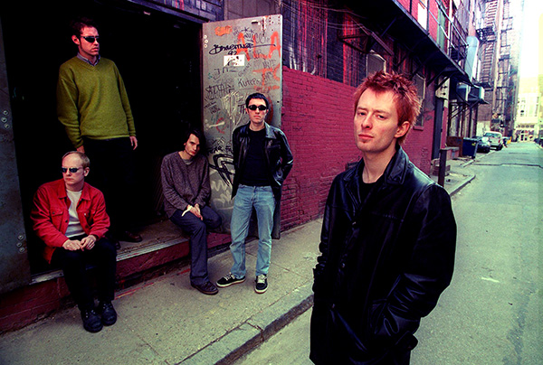 Radiohead in back alley, 1996, when it was announced they would play T in the Park. Photo courtesy Trinity Mirror / Mirrorpix / Alamy Five members of the band Radiohead lounging in back alley of a street, around 1996, when it was announced they would play T in the Park