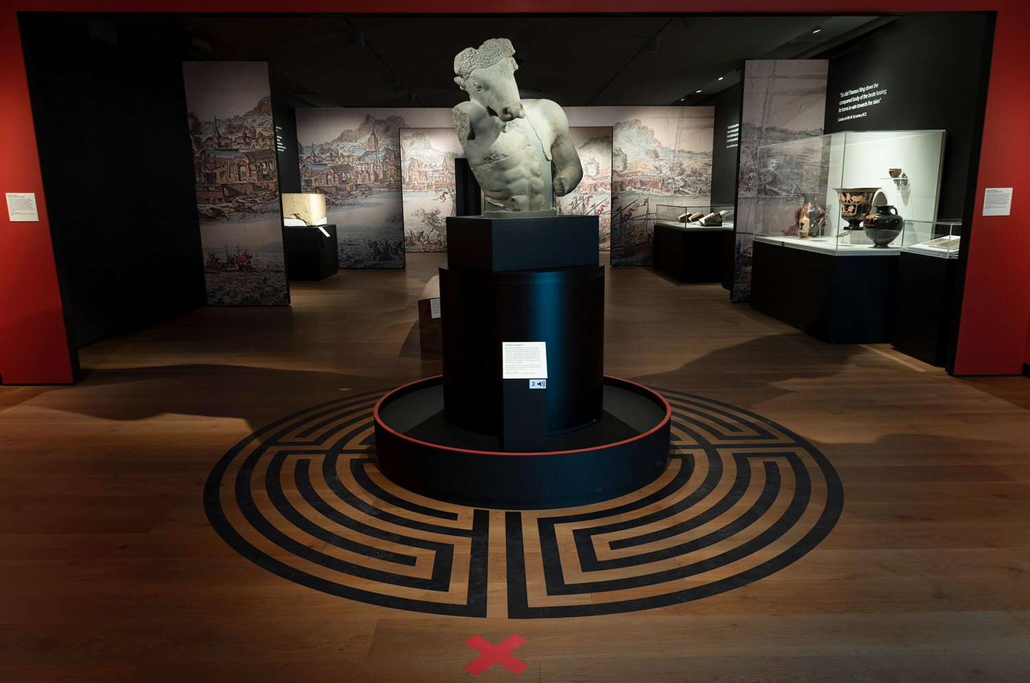 The opening gallery scene inside the Labyrinth exhibition showing the striking white marble Minotaur statue
