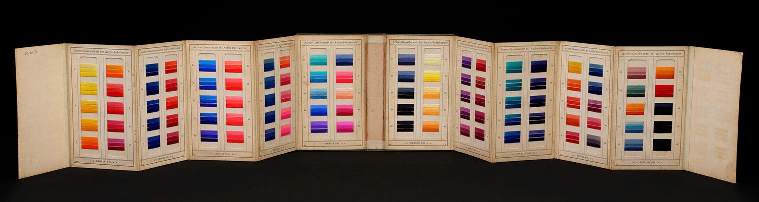Synthetic dye samples in wool on card showing vivid colours of the rainbow, the Berlin Aniline Co, c.1900