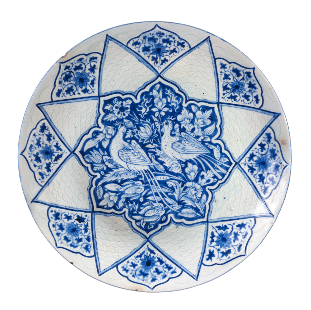 Dish with birds amid foliage