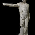 White cast statue of the god Apollo, with his arm outstretched