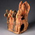 Figurine of an ancient chariot quadriga with three armed and helmeted warriors