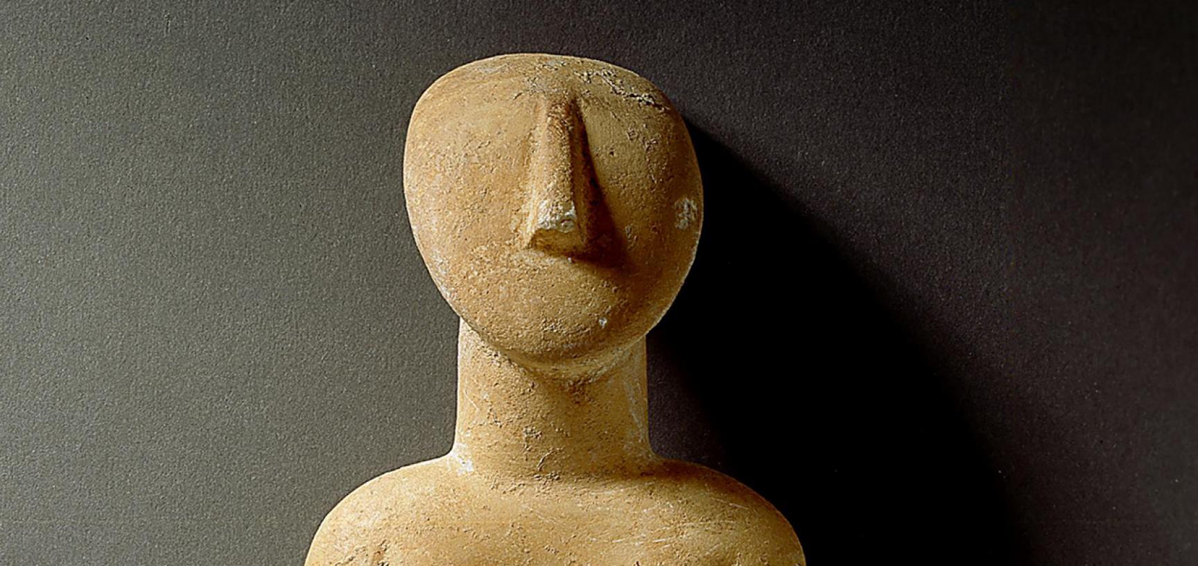 Cycladic figure.