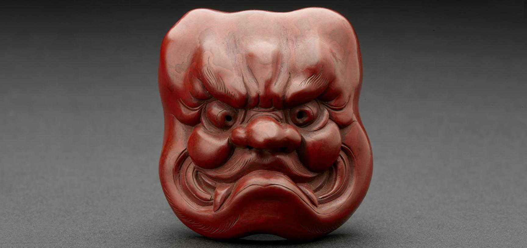  Netsuke Red lacquer mask of Ō-Beshimi by Matsuki Hōkei