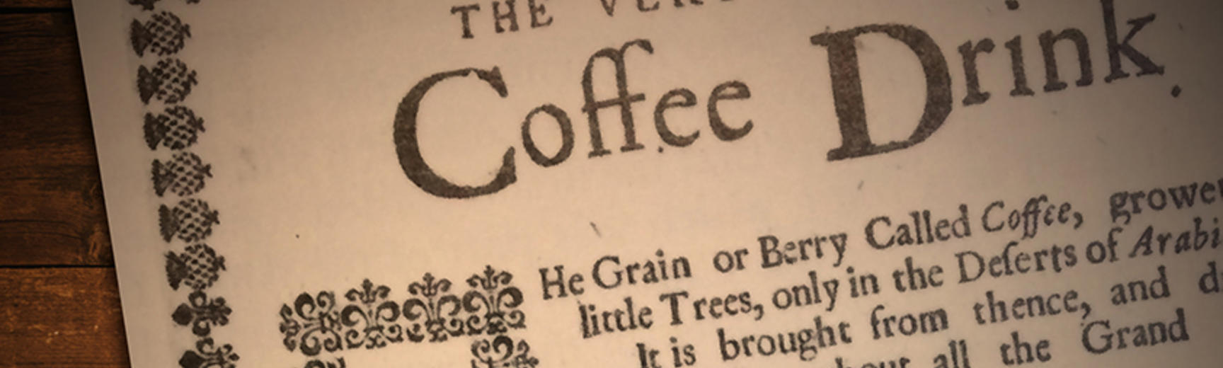 Two copper coins on top of a page titled The Vertue of the Coffee Drink