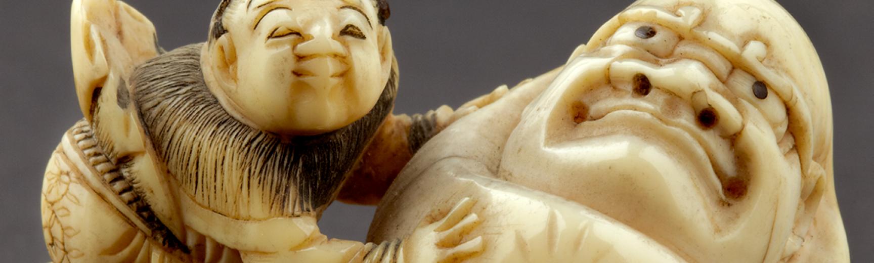 EA1956.1738 Netsuke in the form of a boy rolling a yuki daruma, or snowman
