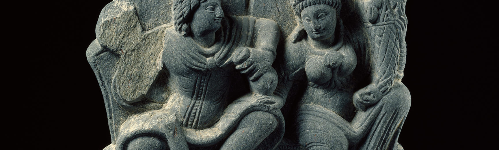Hariti seated with Panchika, holding ‘horn of plenty’