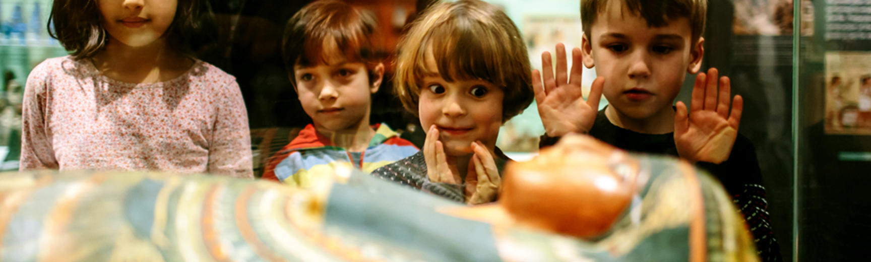 Children looking at a mummy in Egypt galleries