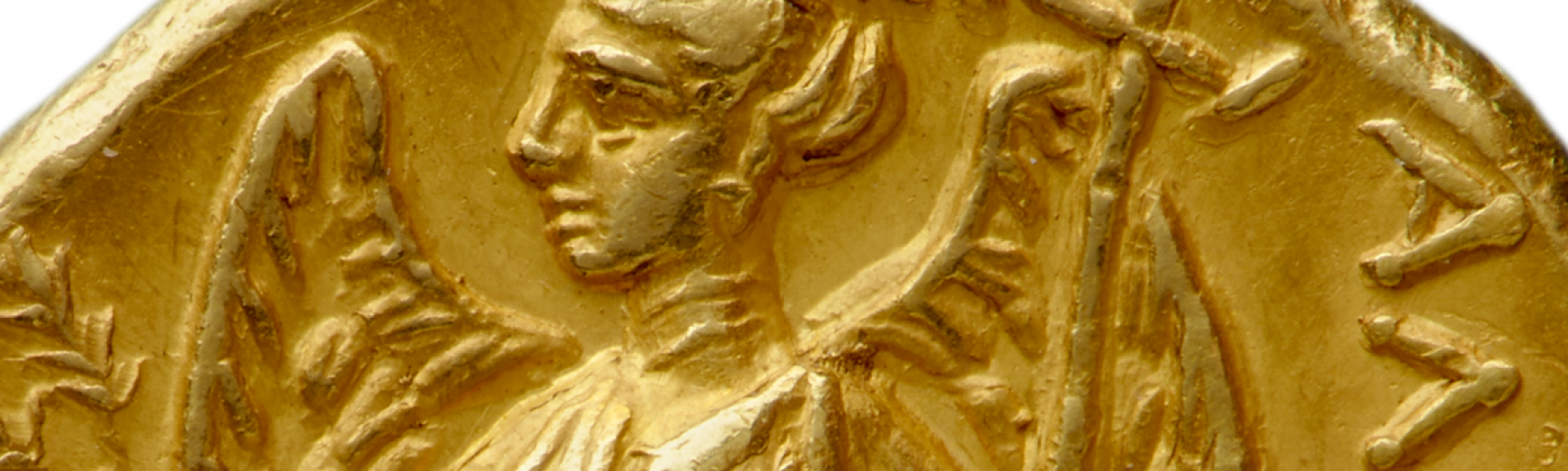 Figure of a winged nike on a gold coin