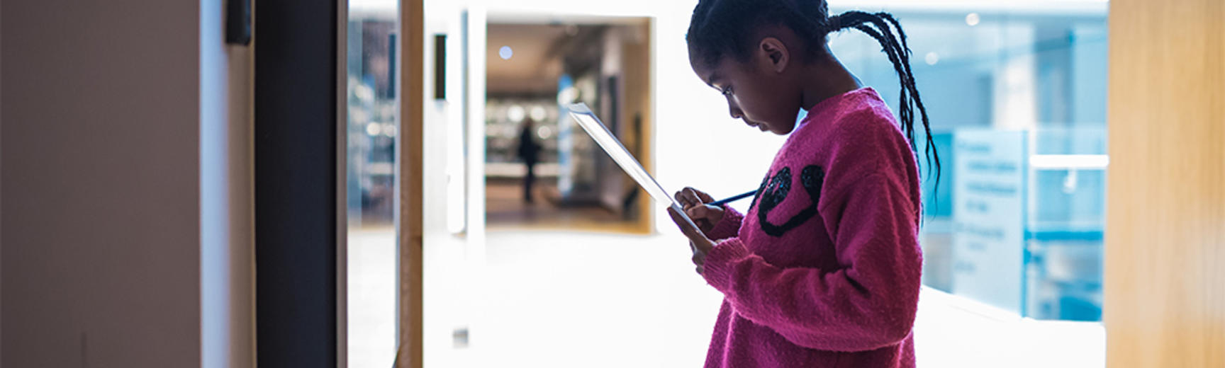 A child in the galleries completing a family trail