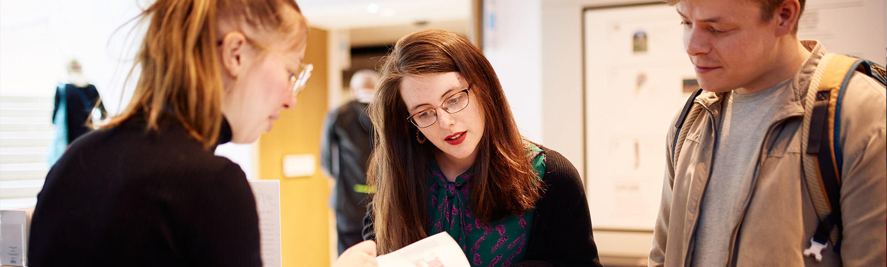 Visitors at the welcome desk