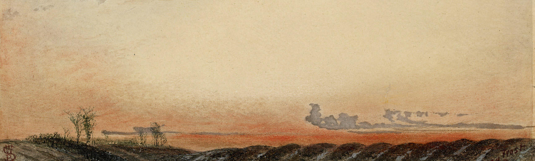 Winter landscape with a few tree silhouettes and sun and clouds above frosty fields