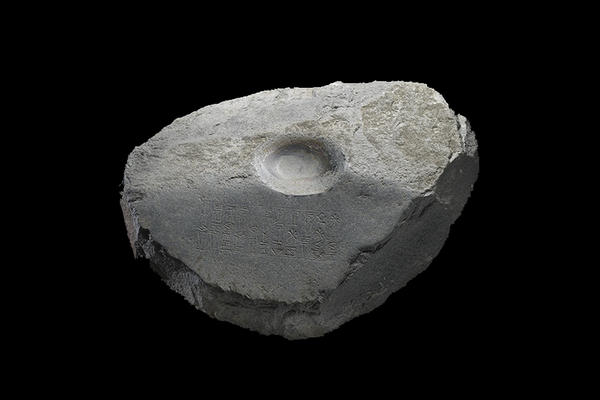 A stone with an indent in the centre, used as a door pivot in ancient Sumer