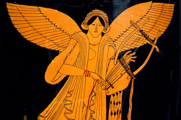 An orange winged Nike figure playing a lyre instrument on a black ceramic pot