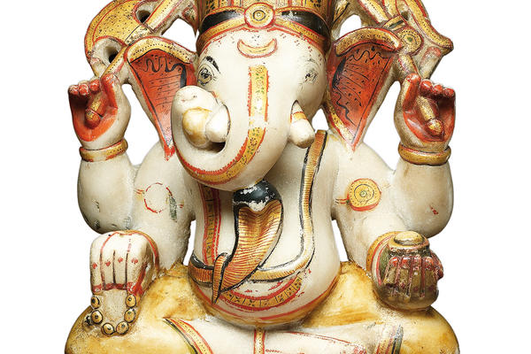 A colourful soapstone sculpture of the god Ganesha in elephant form