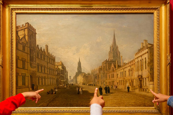 Family pointing at the Oxford painting on the Ashmolean Adventure in the Landscapes gallery