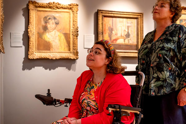 Two visitors look at paintings in the Sickert Gallery at the Ashmolean