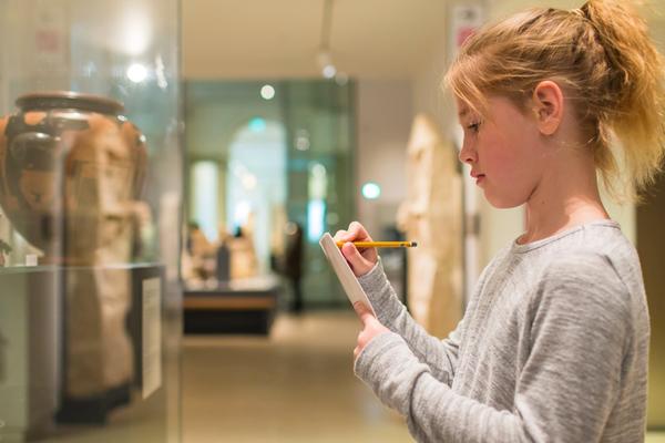Girl doing an activity in the galleries at a family event