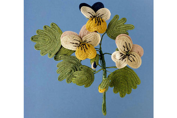 Yellow miniature needlework pansies could be love tokens or 'favours' dating from the 17th or 19th century