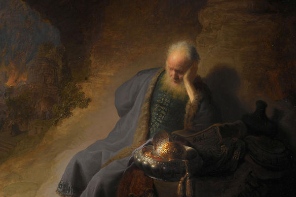 A painting of a old man in a blue robe resting in a cave.