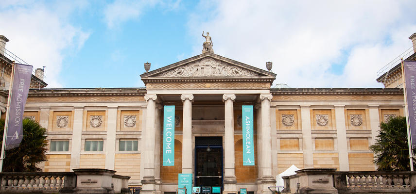 The front of the Museum against a blue and cloudy sky