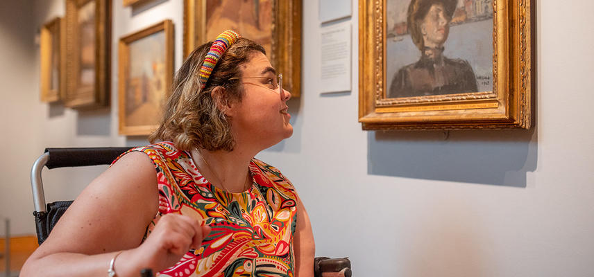 A visitor viewing a painting in the Sickert Gallery at the Ashmolean