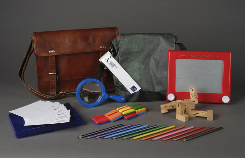 Schools SEND bag / pack and contents, including pencils, an etch-a-sketch, and a magnifying glass An activity pack and its contents, including pencils, an etch-a-sketch and a magnifying glass