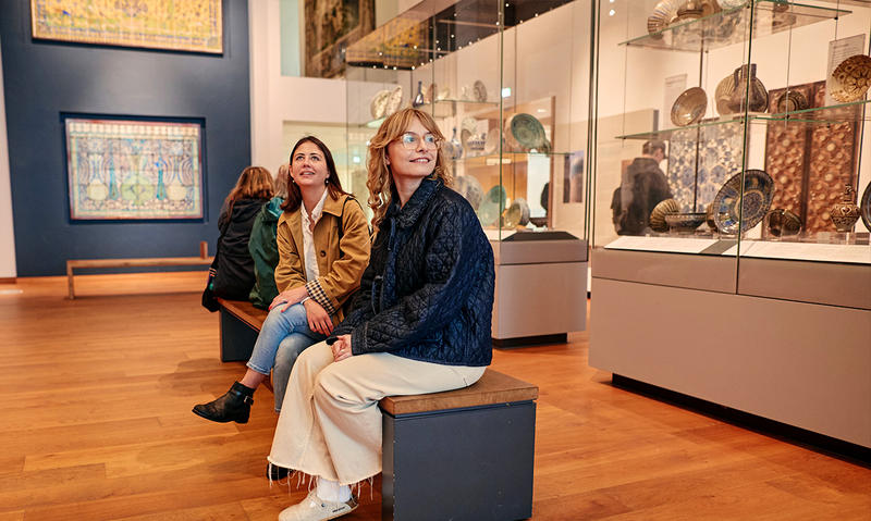 Visitors on the seats in the Ancient Middle East Gallery