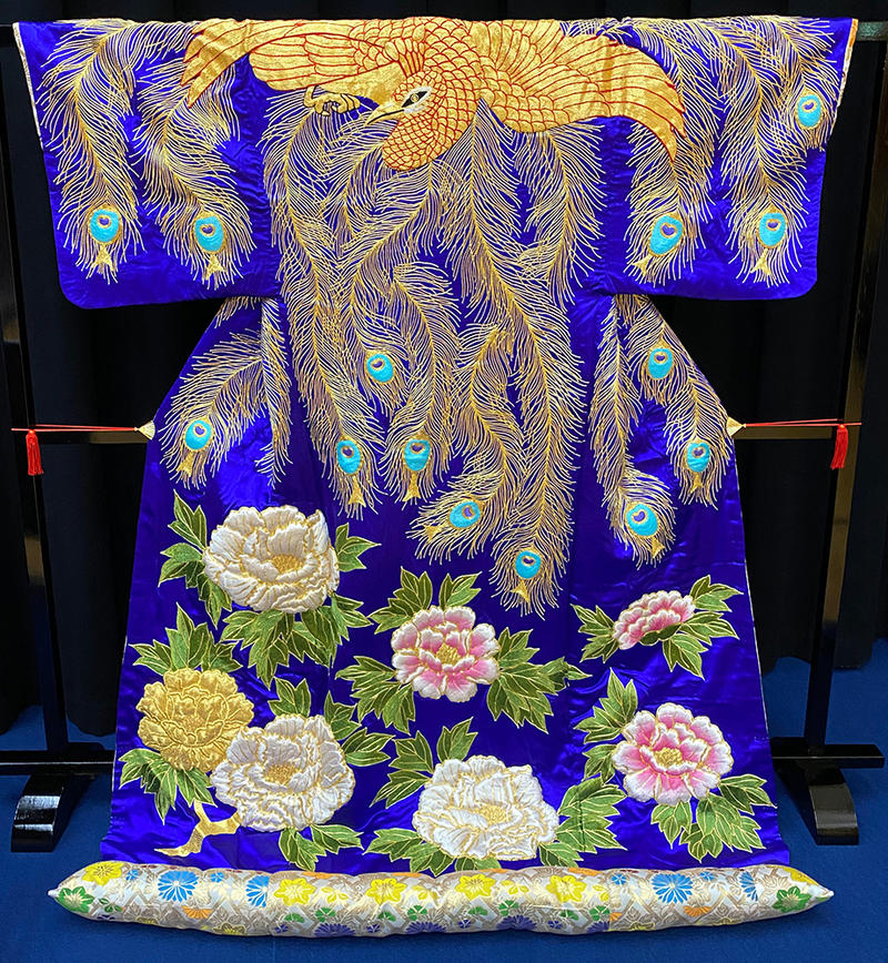 Kabuki kimono costume Kabuki kimono in blue silk depicting white and pink flowers and peacock feathers