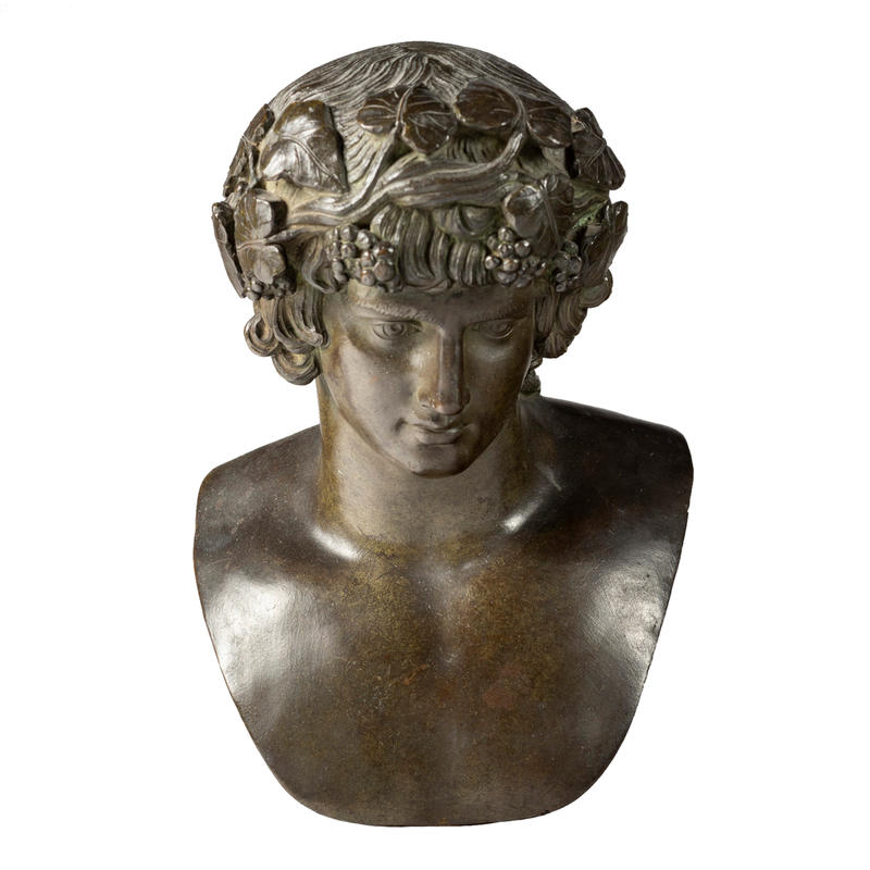 Bronze bust of Antinous as Bacchus, by Francesco Righetti - WA1889.CDEF.B404 An 18th-century bronze bust of the Roman boy god Antinous, dressed as the god Bacchus, with fruits and flowers in his hair