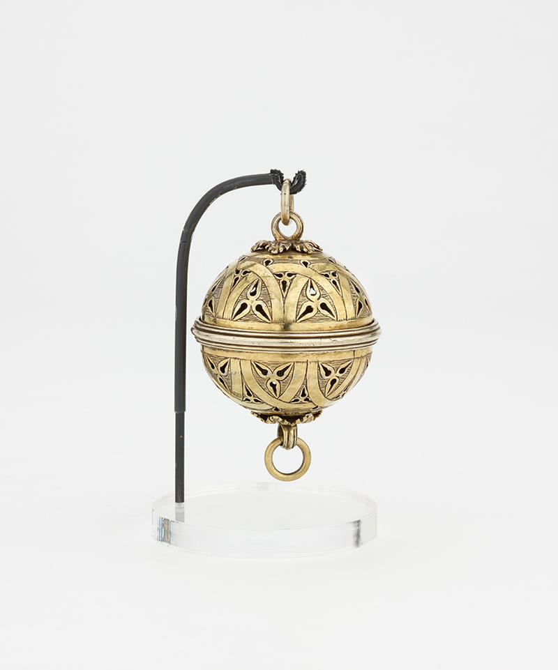 A gold spherical pomander to hold various scents