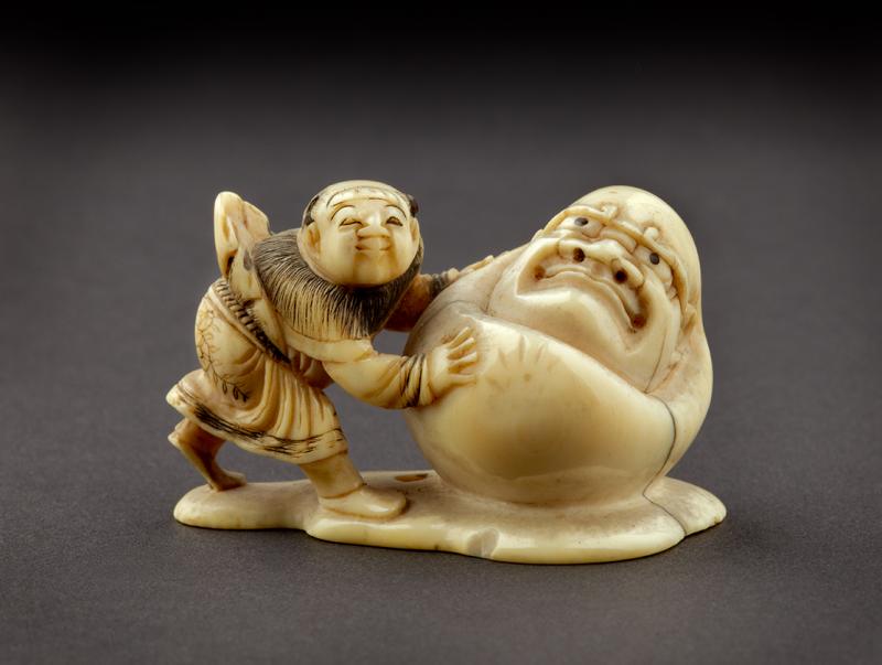 EA1956.1738 Netsuke in the form of a boy rolling a yuki daruma, or snowman EA1956.1738 Netsuke in the form of a boy rolling a yuki daruma, or snowman