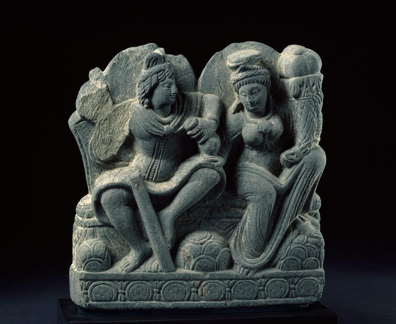 Hariti seated with Panchika, holding ‘horn of plenty’