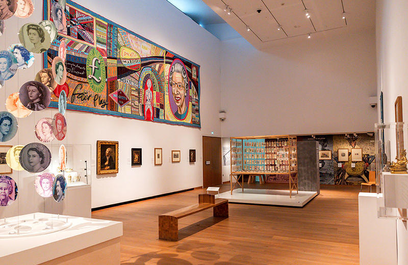 Inside the Money Talks exhibition in gallery 2 with the Grayson Perry Comfort Blanket Inside the Money Talks exhibition in gallery 2 with the Grayson Perry Comfort Blanket