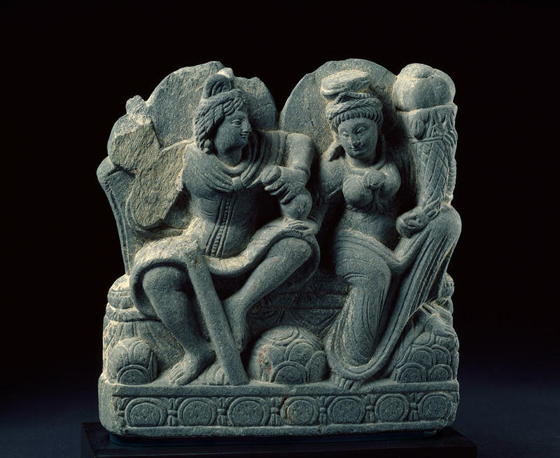 Hariti seated with Panchika, holding ‘horn of plenty’