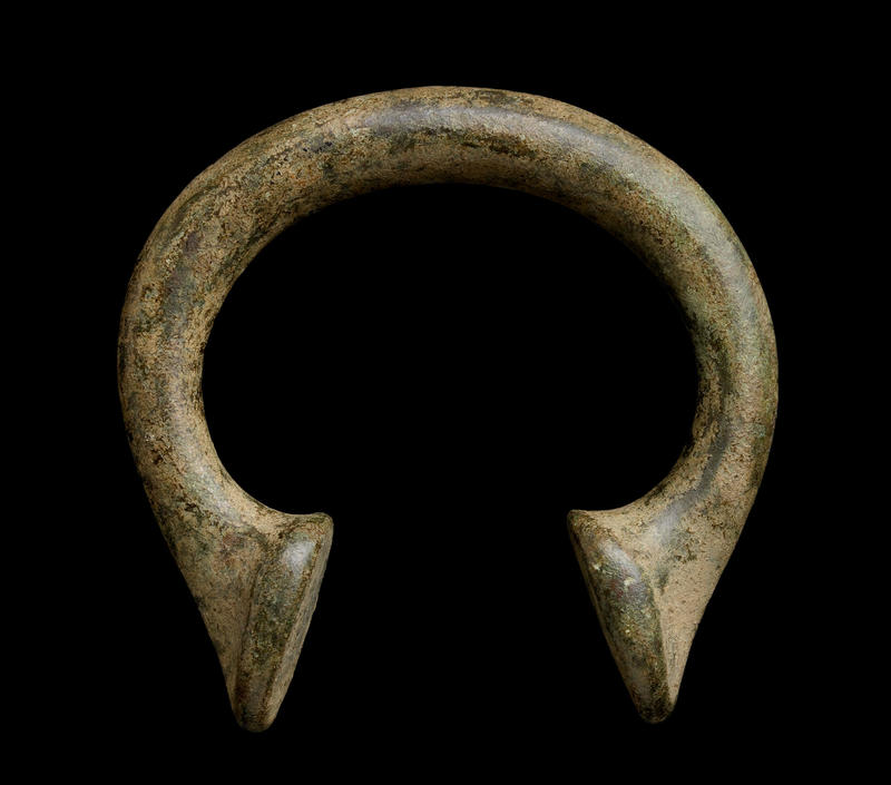 Bronze Manilla HCR6515 A bronze African manilla against a black background