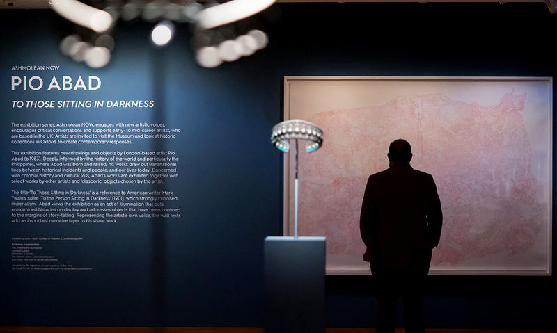 Inside the Pio Abad Ashmolean Now exhibition gallery © Ashmolean Museum / Hannah Pye Inside the Pio Abad exhibition showing the sign and the visitor looking at the Powhatan's Mantle drawing