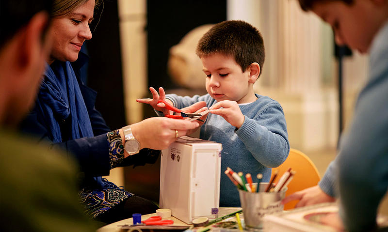 Mum and son having messy fun at craft activities