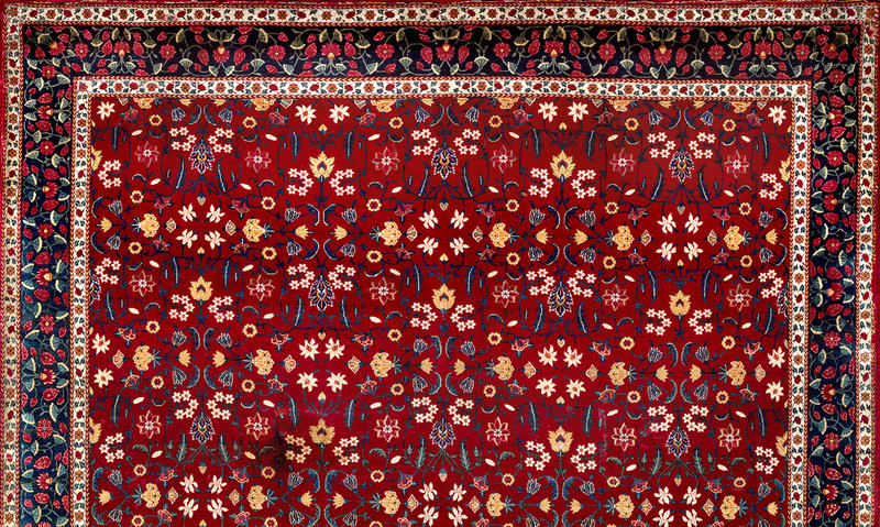 Dark red floral design Mughal carpet