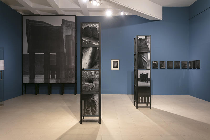 Collapse installation artwork with hanging black and white panels by Bangladesh artist Munem Wasif
