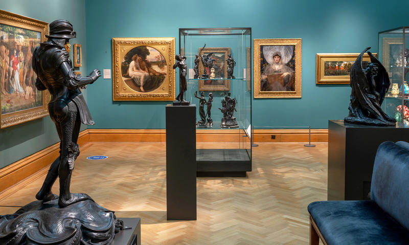 Inside the Pre Raphaelites gallery showing the Violet Manners portrait and the Triumph of Love painting
