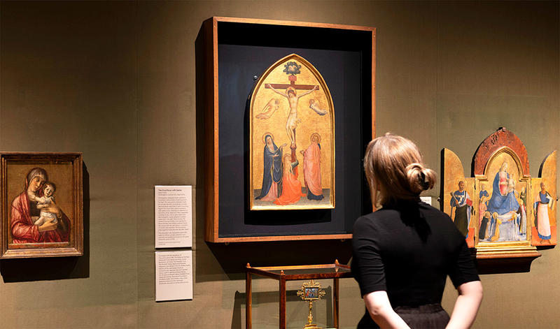 Fra Angelico's Crucifixion painting display with visitor Fra Angelico's Crucifixion painting display with visitor