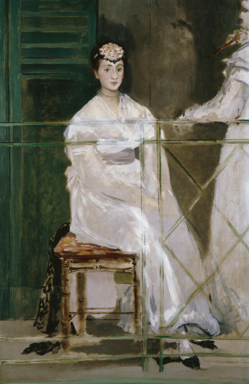 A woman wearing a white dress, seated on a balcony
