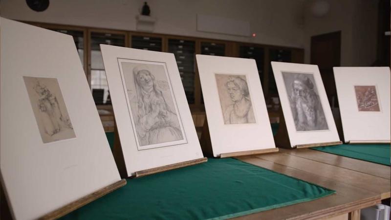 Five artworks propped up on a table in the Ashmolean's Western Art Print Room