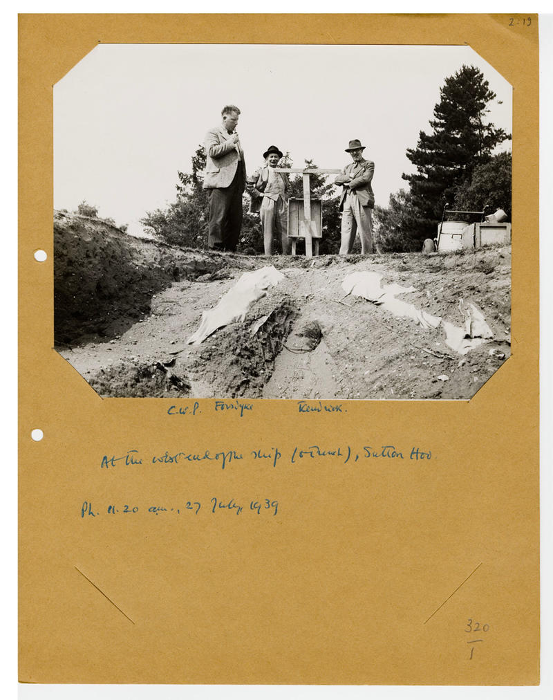 Krasis blog post image 2021: The west end of the ship, Sutton Hoo burial 27th July 1939 A black and white photograph of figures next to an archaeological dig, with handwritten notes underneath