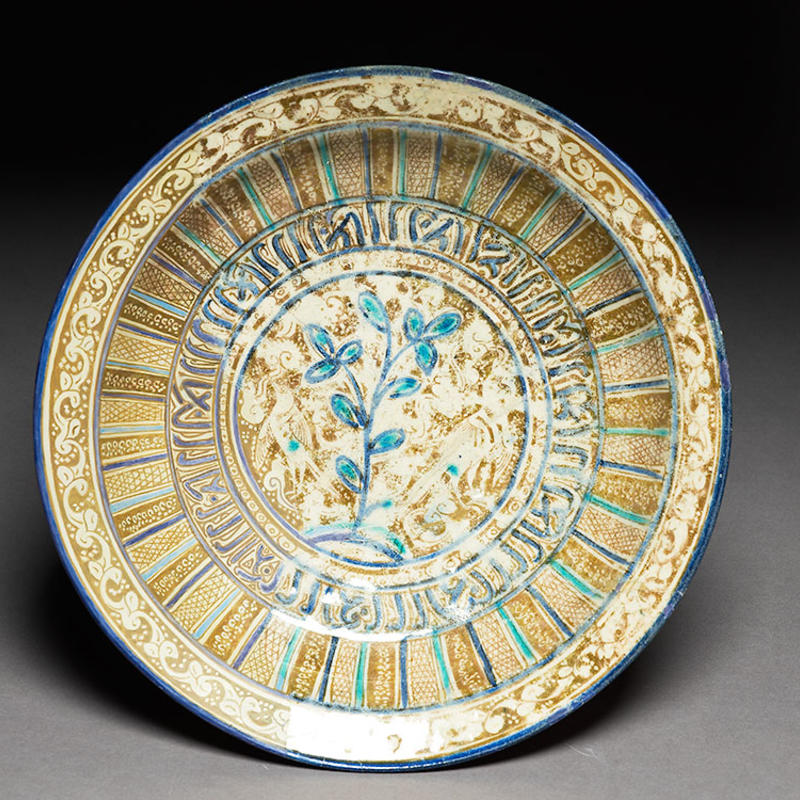 Bowl with vegetal decoration and pseudo-inscription, Iran, 13th century, EA1978.1669.jpg Bowl with vegetal decoration and pseudo inscription, Fritware with overglaze painting in lustre, Iran, 13th century