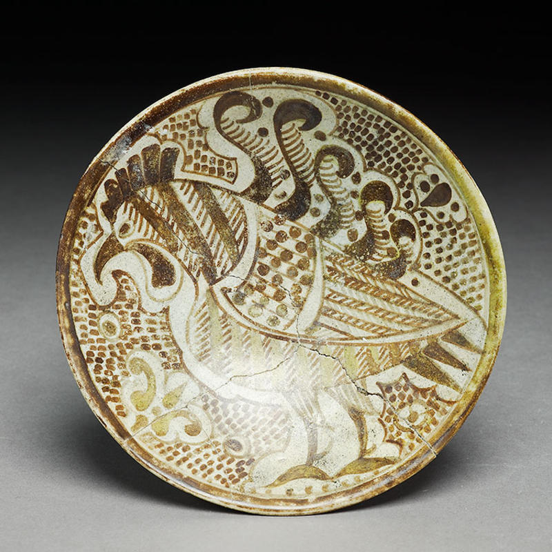 Saucer with cockerel, Iraq, 10th century, earthenware with painting in lustre, EA1978.2144.jpg Earthenware with painting in lustre of a cockerel on saucer, Iraq, 10th century