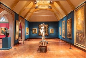 A view inside the Watts Gallery, with sculptures and paintings on display