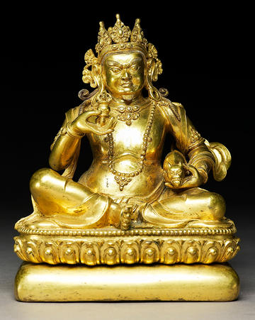Seated figure of Kubera, the Hindu and Buddhist god of wealth Tibet, 18th –19th century Gilt bronze