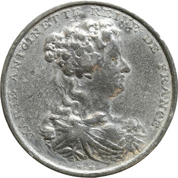 white metal medallion